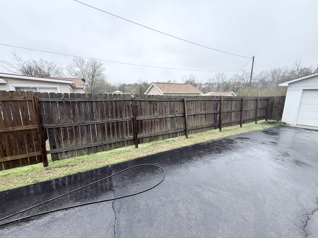 Before - Before and after fence cleaning in Donelson TN showing restoration of weathered wood fence