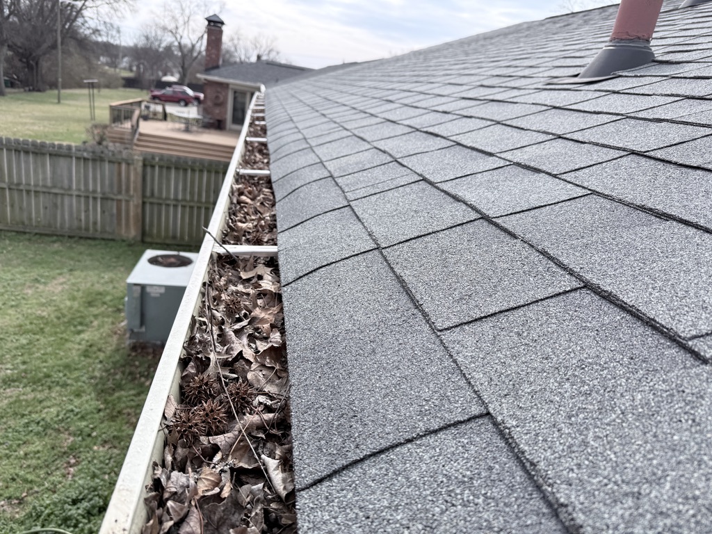 After - Before and after gutter cleaning Nashville TN - removing debris and leaves from clogged gutters