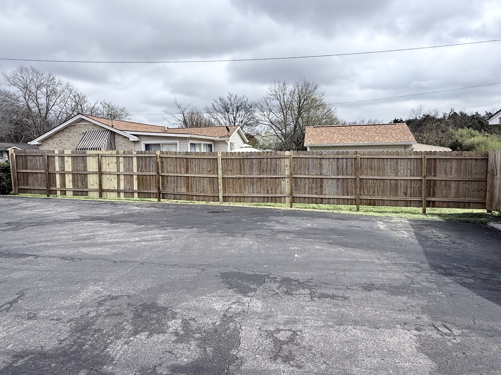 After - Before and after fence cleaning in Donelson TN showing restoration of weathered wood fence